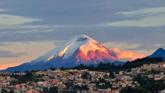 Panoramic view of Ecuador’s Avenue of Volcanoes with snow-capped peaks.
